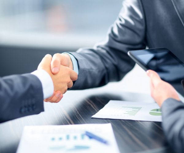Business people shaking hands in office